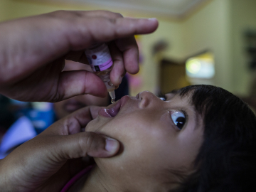 A child looks uncertain as he receives a polio vaccine at a health care center in Bogor, West Java, Indonesia, on April 3, 2023. Aditya Aji/AFP via Getty