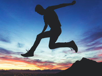 A silhouetted youth leaps across a sunset in Cape Town, South. Africa. Joshua Earle / unsplash