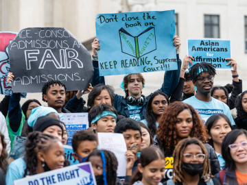 A diverse group of young people hold signs during a rally in support affirmative action policies outside the US Supreme Court in Washington, D.C., October 31, 2022. Eric Lee/The Washington Post/Getty Images
