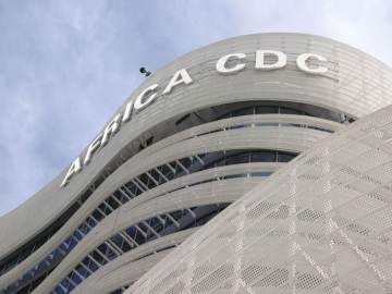Close-up on &quot;Africa CDC&quot; sign emblazoned on grey Africa CDC headquarters building in Addis Ababa, Ethiopia.