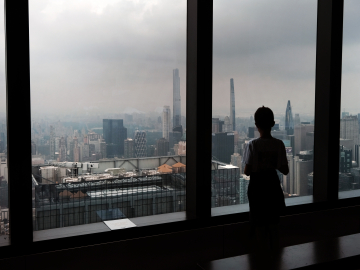 A child looks out at a hazy skyline from an overlook in midtown Manhattan on July 19, 2023 in New York City.