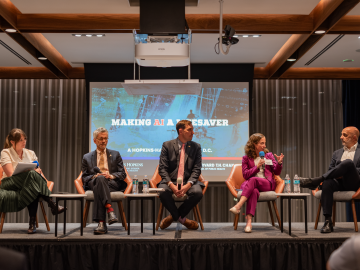 Biostatistician Elizabeth Stuart (in purple) makes a point to HHS assistant secretary Micky Tripathi; other AI event panelists (l to r): Alison Snyder, John Auerbach, and Jesse Ehrenfeld.