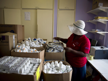 A health worker manages supplies in a PEPFAR-funded AIDS clinic in Johannesburg, South Africa, on January 27, 2012
