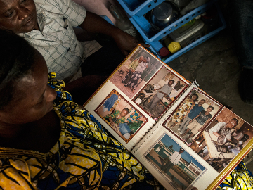 Gaby Ngabu Kasongo and Grace Neema Bandole looking through their engagement photos