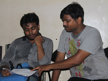 Two men working to procure funding for their wives’ chemotherapy treatments.