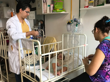 Still from video slideshow of Mylene with her child who has congenital Zika syndrome