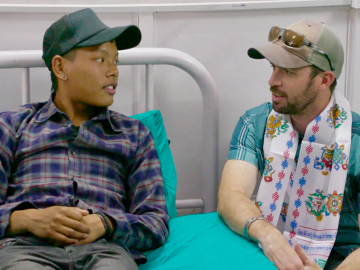 Chris Bombardier (right), a winner of the 2018 Untold Global Health Stories contest, visiting a hospital on a trip to Nepal