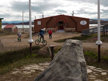 Children play outside the Elder's Qammaq in downtown Iqaluit, Nunavut.