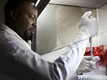 A lab technican works with pathogen samples as part of research into dangerous animal pathogens in the Global Viral Forecasting Initiative Lab in Yaounde, Cameroon, July 28, 2011. Image: Brent Stirton/Getty
