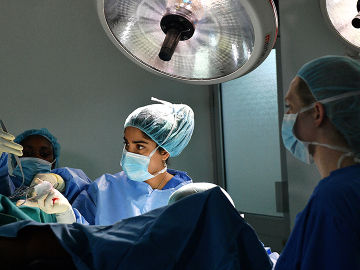 Surgeons are at work during restorative surgery on a survivor of female genital mutilation in Nairobi, Kenya on May 11, 2017.