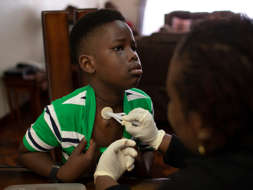 Ethan Miruka, 10, receives blood clotting medicine every 48 hours, a procedure that his mother carries out in their family home. It allows him to carry on a normal life.