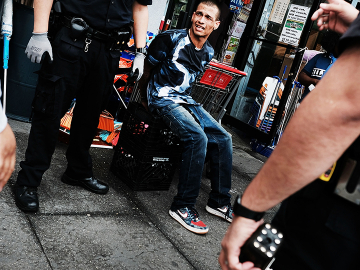 Police detain a man for suspected drug use in New York City’s South Bronx on June 7, 2017. Image: Spencer Platt/Getty