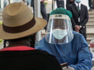 A health care worker tests for COVID-19 yesterday in Antananarivo, Madagascar. Photo by RIJASOLO/AFP via Getty Images