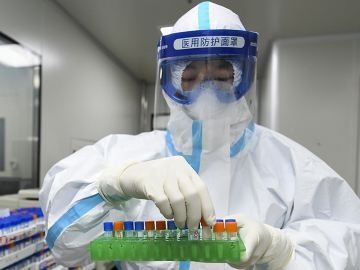 A medical worker handles samples for nucleic acid test at Weishi Medical Laboratory on March 4 in Changsha, China.