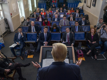 President Donald Trump briefs the press on March 21. Photo by Tasos Katopodis/Getty Images