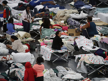 People take shelter after flood waters from Hurricane Harvey inundated Houston, Texas. August 29, 2017. Image: Joe Raedle/Getty