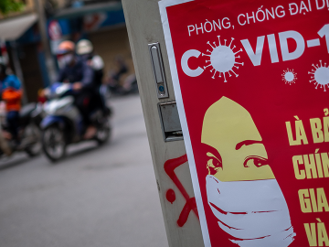A poster in Hanoi, Vietnam reminds people to take protective measures against COVID-19, April 1, 2020 in Hanoi, Vietnam. Image: Linh Pham/Getty