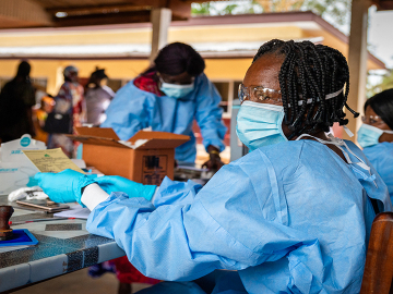 A health worker prepares a COVID-19 vaccination certificate in Bimbo, Central African Republic, on November 15, 2021. Image: Barbara Debout/AFP/Getty