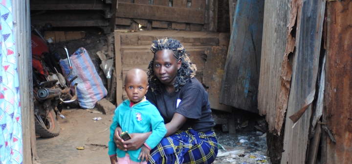 Mary Ndira sist outside their house next to a drainage in Kibera slums on March 2, 2022 Photo-Dominic Kiruli