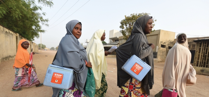 Health workers walk from house to house during a polio vaccination campaign in Hotoro-Kudu, Nassarawa district of Kano, Nigeria. April 22, 2017.  Pius Utomi Ekpei/AFP via Getty Images