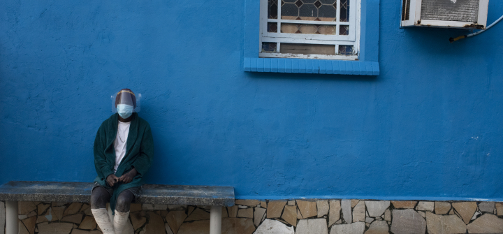 A leprosy patient sits outside the abandoned Curupaiti Colony Hospital in Rio de Janeiro on November 21, 2021.