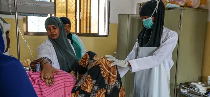 Staff care for a pregnant patient in the Trocaire Doolow Hospital in Doolow, Somalia, October 15,2022. Photo by Giles Clarke/UNOCHA/Getty.