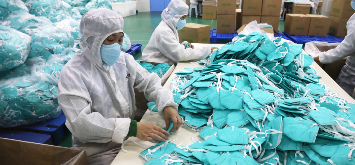 Employees work on the production line of N95 facemasks at a factory on December 8, 2022 in Xuchang, Henan Province of China. Niu Shupei/VCG via Getty Images