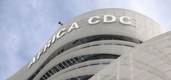 Close-up on "Africa CDC" sign emblazoned on grey Africa CDC headquarters building in Addis Ababa, Ethiopia.