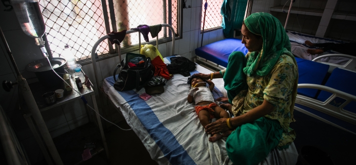 Sahil, a 7-month-old child suffering from diarrhea, lies in a bed at the district hospital on May 21, 2022 in Mirzapur, Uttar Pradesh, India.