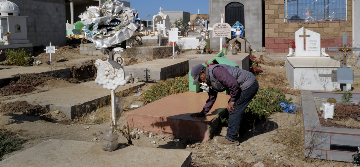 Aron Villanueva tends to the Ejido Padre Kino, Mexico, grave of his grandson Axel Villanueva. June 6, 2023. 