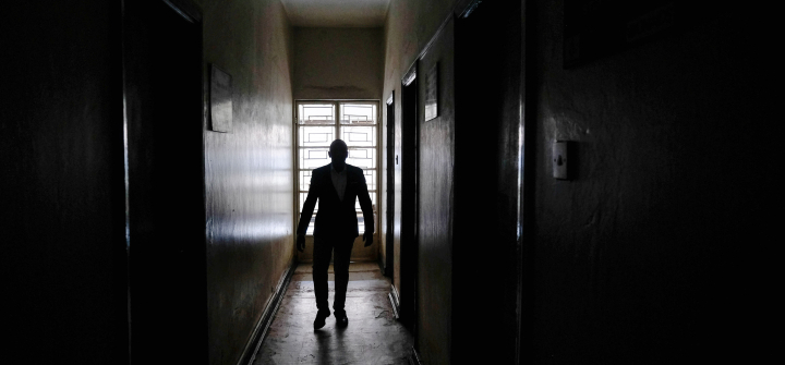 Kruish Mubiru, executive director of Uganda Young Positives, walks amid the organization's empty facilities, on February 12, 2025, in Kampala, Uganda. 