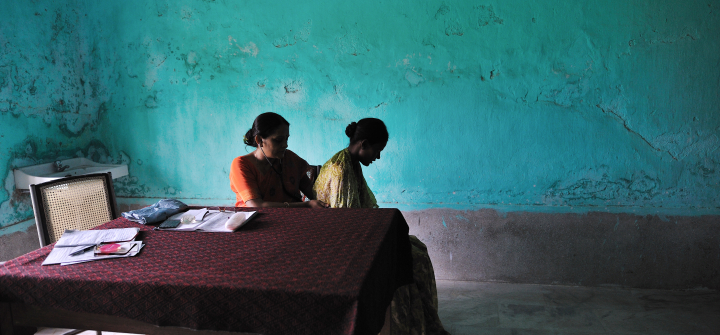 Dr. Renu Singh checks a patient for possible signs of tuberculosis in the district TB center in Patna, Bihar, India, on August 10, 2010.