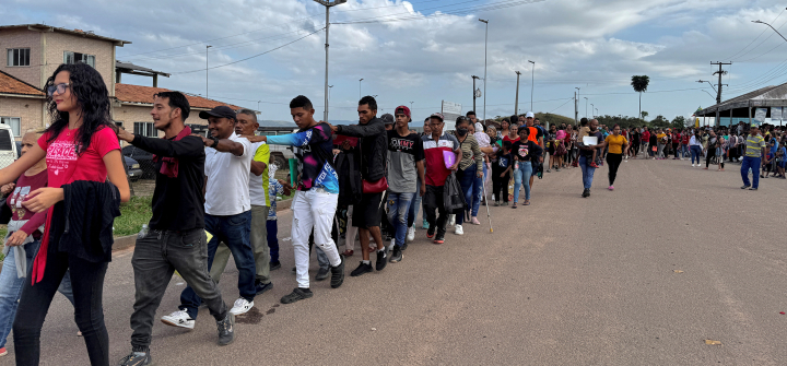 Venezuelan refugees walk after crossing the border between Venezuela and Brazil in the city of Pacaraima, Roraima State, Brazil, on September 13, 2024. 
