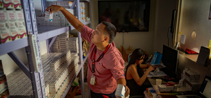 A pharmacist stocks PrEP medicine at a pharmacy in a community center operated by LoveYourself, a nonprofit impacted by the Trump administration's freeze on foreign aid, on February 19, 2025, in Mandaluyong, Metro Manila, Philippines