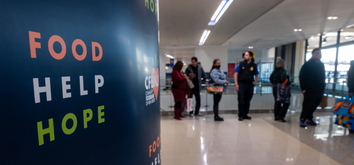 Federal workers impacted by the government shutdown, including TSA officers and air-traffic controllers, line up to receive food parcels at Newark Liberty International Airport, in New Jersey, on October 27, 2025.