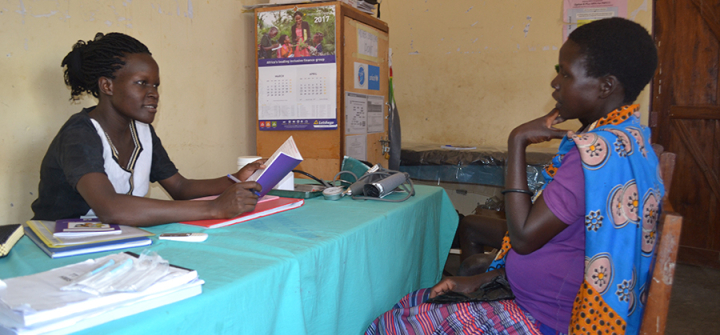 Caroline Akello attending to a mother at Loktelabu Health Centre III, Uganda. 