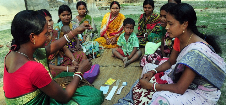 A rural health worker teaches women about the IUD and other contraceptive methods at a remote village in Kushamandi, South Dinajpur, West Bengal, India.