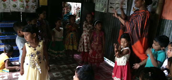 A day in an anchal: Children sing and dance to a Bangla rhyme along with their crèche mother. 