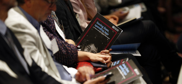 Audience members peruse a new WHO report on NCDs at its May 20 release in Geneva. (Image: Courtesy of Bloomberg Philanthropies)