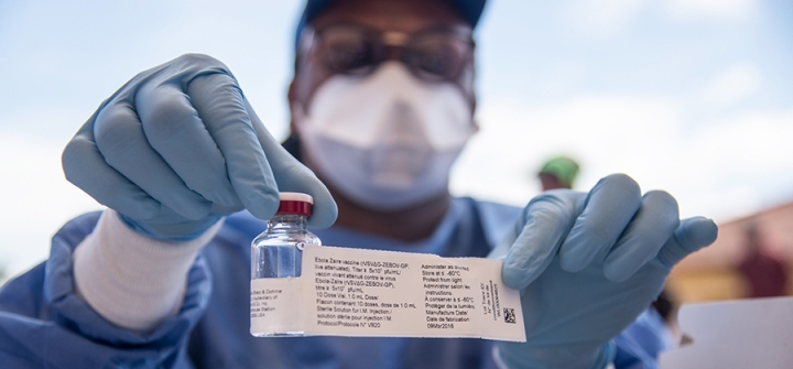 A nurse working with the WHO shows a bottle containing Ebola vaccine in Mbandaka, May 21, 2018. 