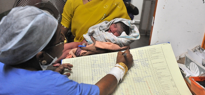 A nurse registers the records of a new born baby boy at Governement Gandhi Hospital in Hyderabad on October 31, 2011.