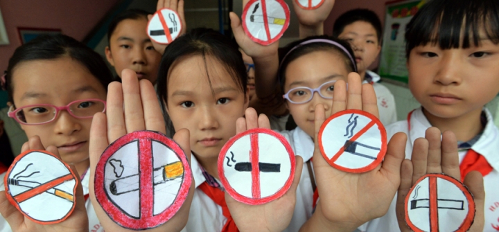 Students hold up no smoking signs to support World No Tobacco Day at a primary school in northern China's Hebei province, on May 30, 2016. STR/AFP/Getty Images