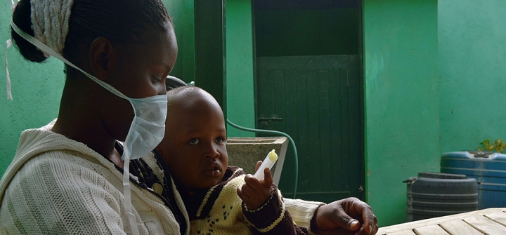 John, 3, who suffers from multi-drug-resistant tubeculosis (MDR-TB), is held by his mother Elizabeth, also an MDR-TB case, after she gave him his medication at an MSF-run clinic in Nairobi. 