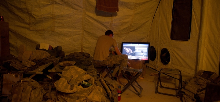 A US soldier plays video games in Lakhokad camp near Kandahar city on November 26, 2010. Image: Martin Bureau/AFP/Getty Images