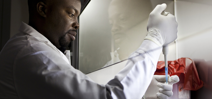 A lab technican works with pathogen samples as part of research into dangerous animal pathogens in the Global Viral Forecasting Initiative Lab in Yaounde, Cameroon, July 28, 2011. 