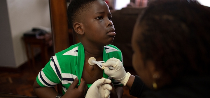 Ethan Miruka, 10, receives blood clotting medicine every 48 hours, a procedure that his mother carries out in their family home. It allows him to carry on a normal life.