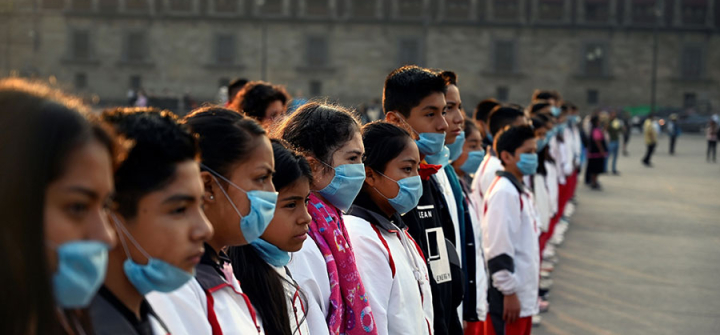 A group of students wear face masks to protect from air pollution during a ceremony at Zocalo Square in Mexico City on May 17, 2019. Alfredo Estrella/AFP/Getty Images)