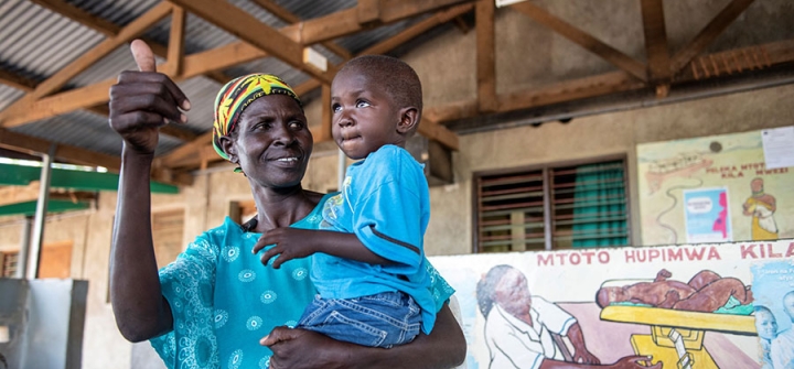 A mother at Kakuma District Hospital, Kenya, is happy that her child is HIV-free, thanks to prevention of mother-to-child transmission services. Eric Bond/Elizabeth Glaser Pediatric AIDS Foundation 2019.
