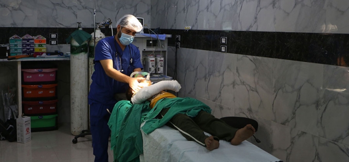 A Syrian doctor checks on a child after a surgery at a hospital in Syria's Idlib province, September 10, 2018. Image: Aaref WATAD/AFP/Getty