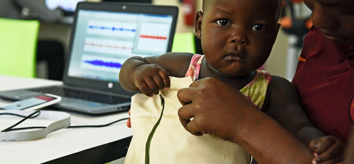 A child at the Makerere University of Public Health in Kampala is fitted with a "smart jacket" that diagnoses pneumonia faster than a doctor. Image: Isaac Kasamani/AFP/Getty 